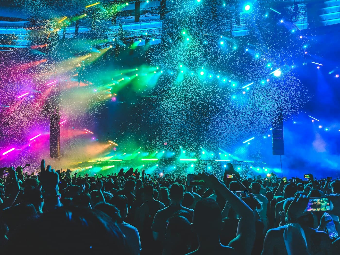 Concert crowd under purple stage lights