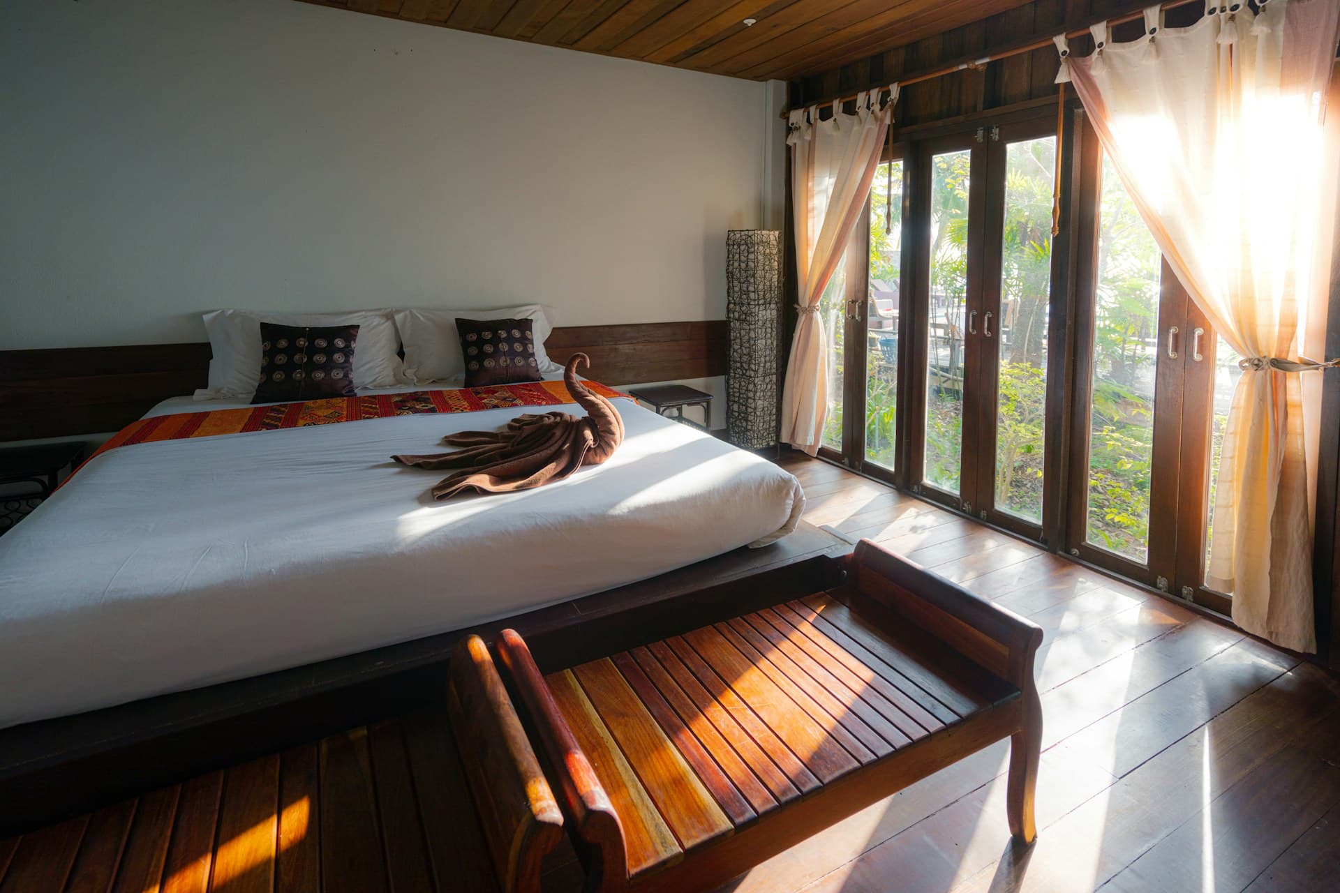 Modern hotel suite bedroom with evening city tone
